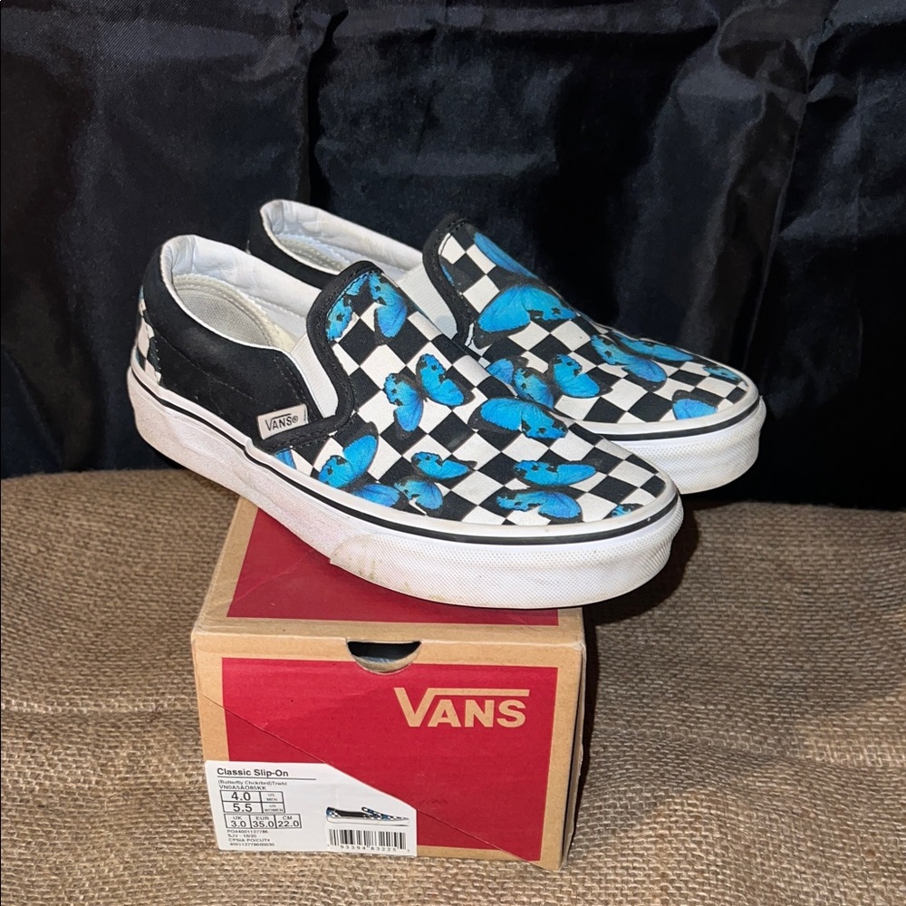 Vans Black and White Checkerboard Slip-Ons with Blue Accents